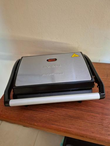 a cell phone sitting on top of a table at Solar de Pipa Prime - Frente piscina in Pipa