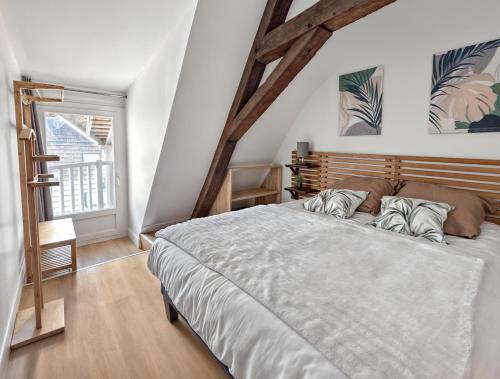 En eller flere senge i et værelse på Maison de ville avec garage privé