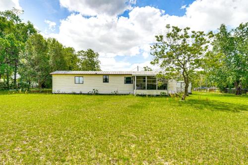 a house with a large yard in front of it at 2 Mi to World Equestrian Center Gem with Large Yard in Ocala