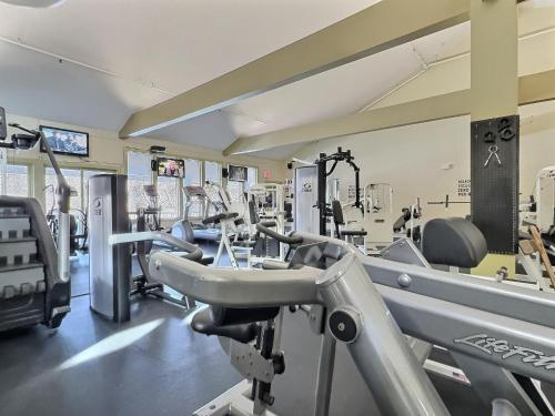 a gym with several treadmills and machines in it at Robins Nest Pool Gym Fireplace Near the AT in Killington