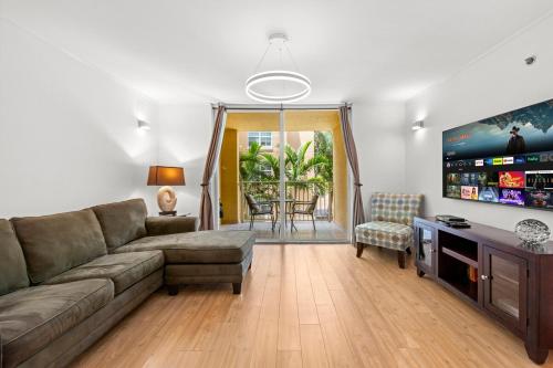 a living room with a couch and a table at Yacht Club Miami Suite 1BR and 1BA with Pool FREE Parking Gym & Jacuzzi in South Island