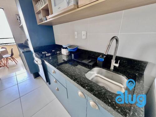 a kitchen with a sink and a counter top at S1703T1 Vista Mar | Sacada Gourmet | Beto Carrero in Penha