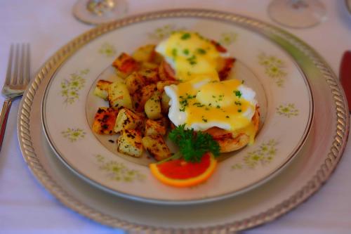 a plate of food with eggs and potatoes on a table at Page House Bed & Breakfast in Dublin