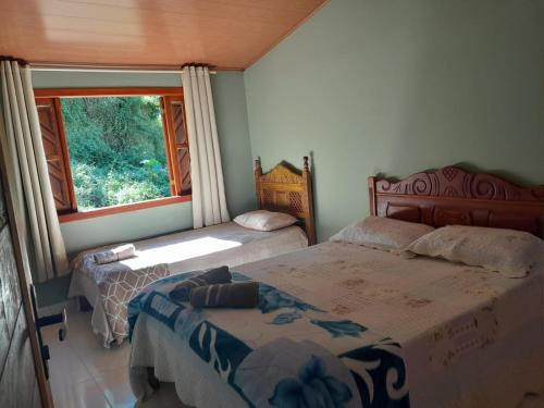 Giường trong phòng chung tại Casa da Pedra
