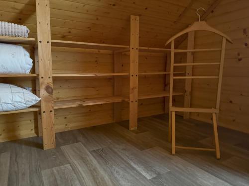 a room with two bunk beds and a ladder at Počitniška hiša z dvema spalnicama Sauna & Jacuzzi in Gorica pri Slivnici