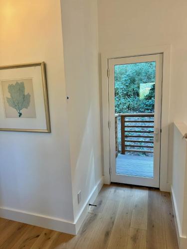 a room with a door leading to a balcony at LUX Private Modern Villa With Pool Spa & Dogs OK in Calistoga