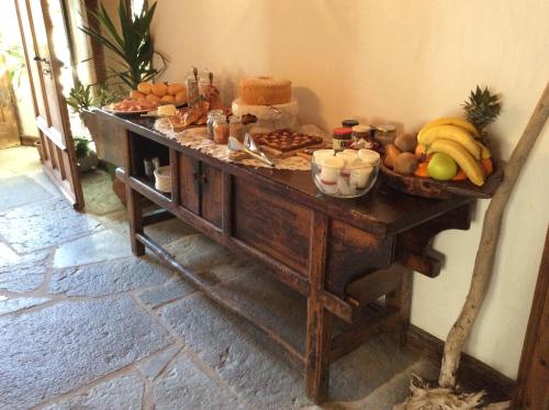 a table with a bunch of fruit on it at B&B Rossodisera in Domegge di Cadore