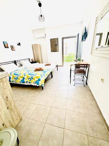a bedroom with a bed and a table at Mani Spot in Areopolis