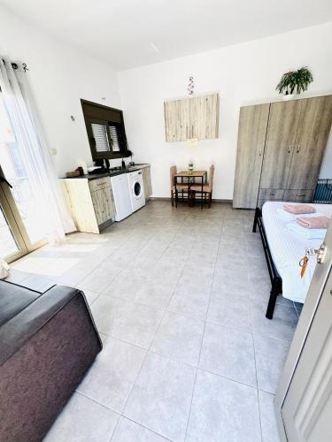 a living room with a couch and a table at Mani Spot in Areopolis