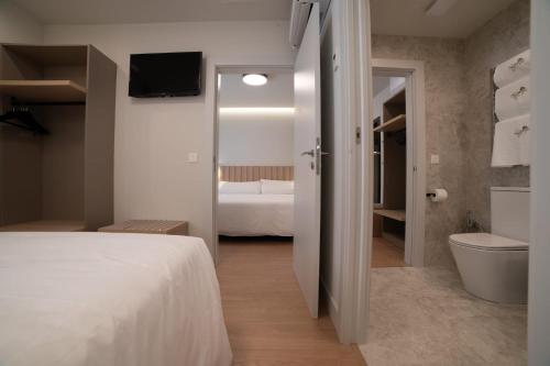 Katil atau katil-katil dalam bilik di Yoanna Hotel