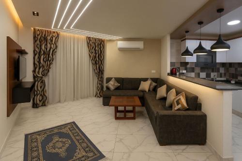 a living room with a couch and a table at Porto Said Chalets, your perfect family getaway destination in Port Said