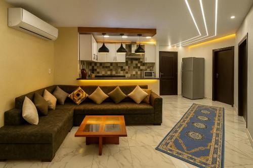 a living room with a couch and a table at Porto Said Chalets, your perfect family getaway destination in Port Said