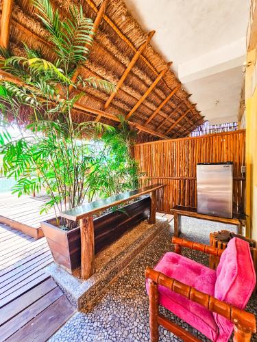 a living room with a couch and a table at Maya Dreams Bacalar in Bacalar