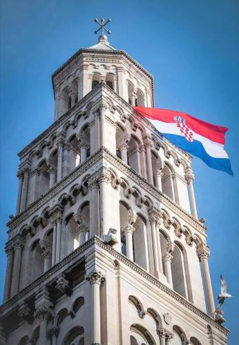 a tall building with a flag on top of it at Digital Nomad Friends in Split