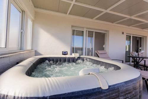 a jacuzzi tub in the middle of a room at Digital Nomad Friends in Split