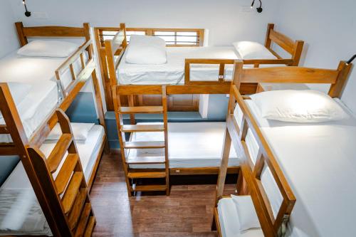 a group of bunk beds in a dorm room at Leo Vishroam in Mysore