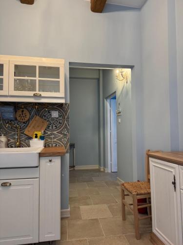 a kitchen with a sink and a counter top at Carmen's 1st floor Apartment with floor Sea View and roof terrace- Lakones in Lákones
