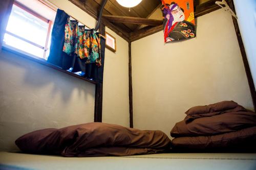 Postel nebo postele na pokoji v ubytování Dot Hostel Nagano