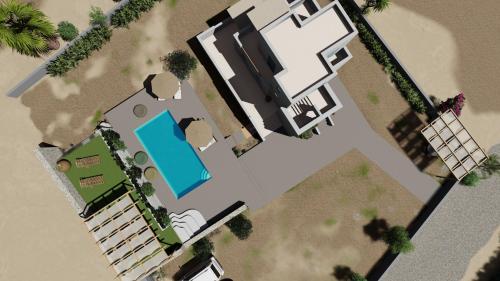 an overhead view of a house with a swimming pool at Diamantis Kitesurf Villa in Mikri Vigla
