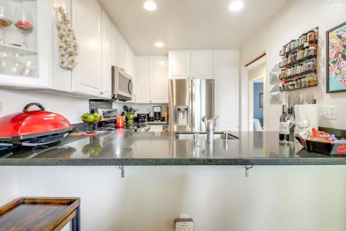a kitchen with white cabinets and a counter top at Private Patio and Workspace Quiet Sonoma Condo! in Sonoma