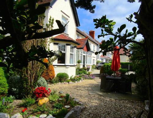 a house with a garden in front of it at Brigstock House in Llandudno
