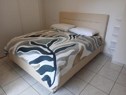 Ένα ή περισσότερα κρεβάτια σε δωμάτιο στο Casa Mameli Apartment