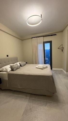 Ένα ή περισσότερα κρεβάτια σε δωμάτιο στο Villa Loggia