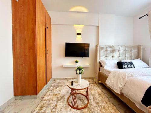 Postel nebo postele na pokoji v ubytování Gushu bnb Homes 082