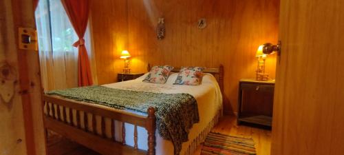 Llit o llits en una habitació de Turismo Jaos Cabañas Tinas y Quincho