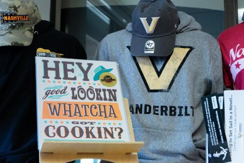 a sign in front of a sweatshirt and a hat at Holiday Inn Nashville - Vanderbilt - Dwtn by IHG in Nashville
