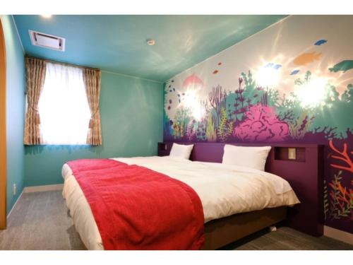 En eller flere senge i et værelse på FourStoriesHotelMaihama Tokyo Bay - Vacation STAY 73101v