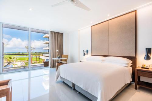 Postel nebo postele na pokoji v ubytování Dreams Karibana Cartagena Golf & Spa Resort