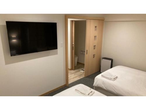 Giường trong phòng chung tại Smile Hotel Fukuoka Okawa - Vacation STAY 81552v