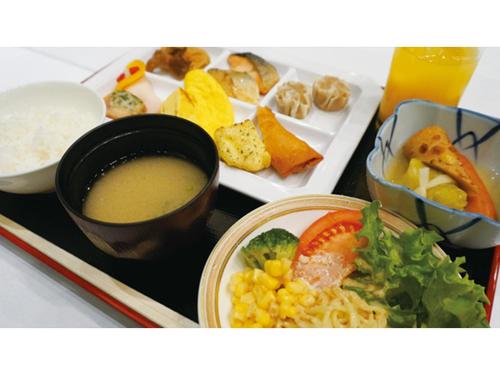 a tray with a plate of food with soup and vegetables at Hotel AreaOne Chitose - Vacation STAY 99105v in Chitose
