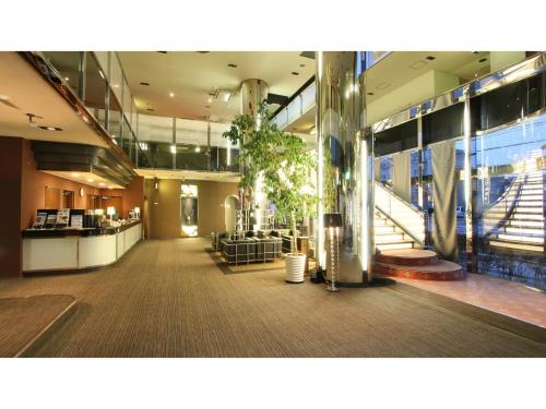 an empty lobby of a building with a restaurant at Hotel AreaOne Chitose - Vacation STAY 99100v in Chitose