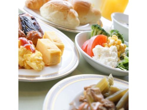 a group of plates of food on a table at Hotel AreaOne Chitose - Vacation STAY 99775v in Chitose