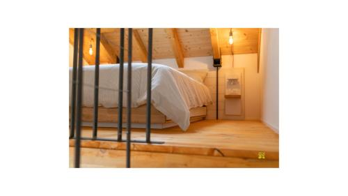a bedroom with a bed with a iron gate at La casa tra gli ulivi in Genova