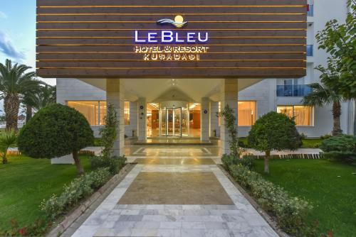 a building with a sign on the front of it at Le Bleu Hotel & Resort Kusadasi in Kusadası