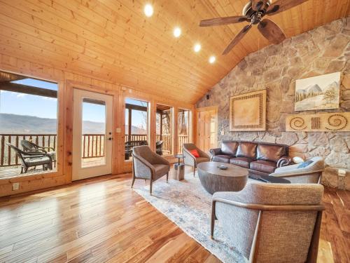 a living room with a couch and a table at Edens View in Gatlinburg