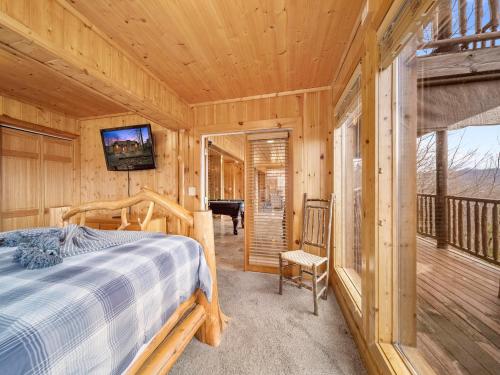 a bedroom with a bed in a log cabin at Edens View in Gatlinburg