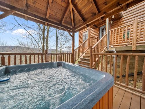 a hot tub on the deck of a cabin at Edens View in Gatlinburg