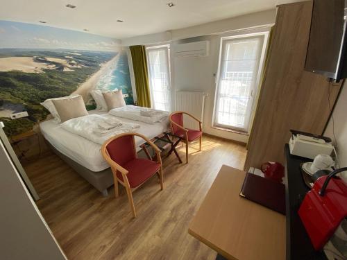 Postel nebo postele na pokoji v ubytování Hotel De Backer