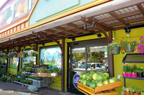 a store front of a store with flowers and plants at Bluebird Day - Fox Den South in Bend