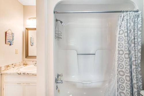 a bathroom with a shower and a sink at Fort Morgan Townhomes E7 in Fort Morgan
