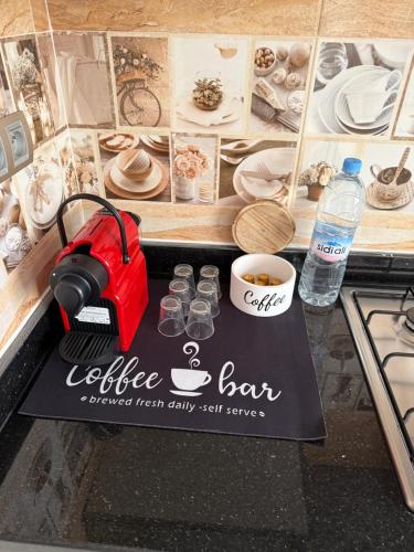 a table with a coffee bar sign on a counter at Appartement de très haut Standing à la Marina de Saïdia Résidence TAMARIS 6 piscine VIP in Saidia 