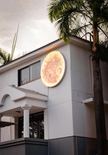 a clock on the side of a building at The L Boutique Tz in Dar es Salaam