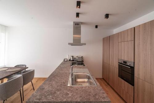 a kitchen with a sink and a counter top at Haus Christl&Franz in Bad Aussee