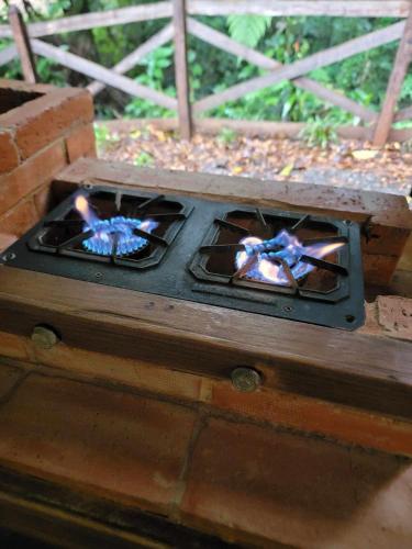 a stove with two candles on top of it at Coco Cabana in the Jungle in Sarapiquí