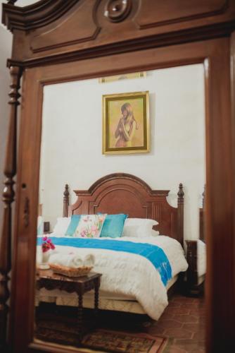 Una cama o camas en una habitación de Hacienda de Comodejé