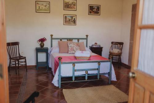 Una cama o camas en una habitación de Hacienda de Comodejé